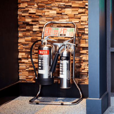 Compact Chrome Double Fire Extinguisher Stand Insitu